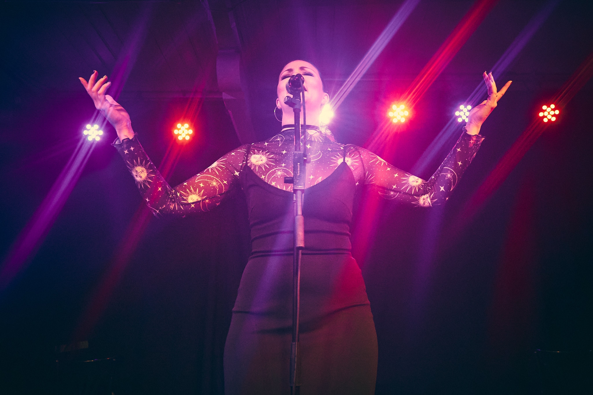 Background image of Sofie performing as a singer